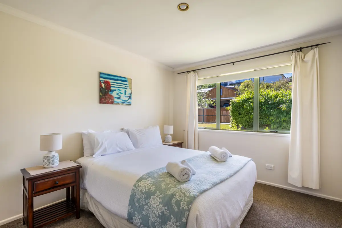 Queen bedroom with natural light