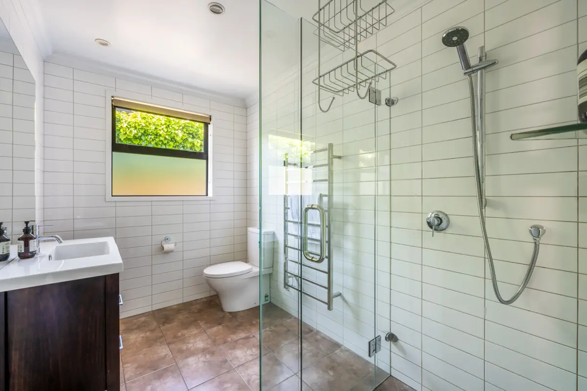 Spacious Bathroom with Glass Shower 