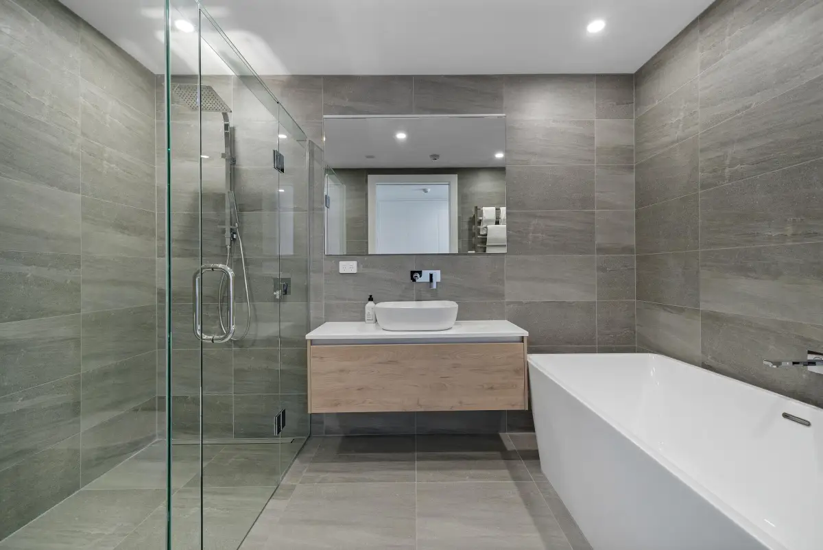 Sleek Bathroom with Bath Tub & Glass Shower 