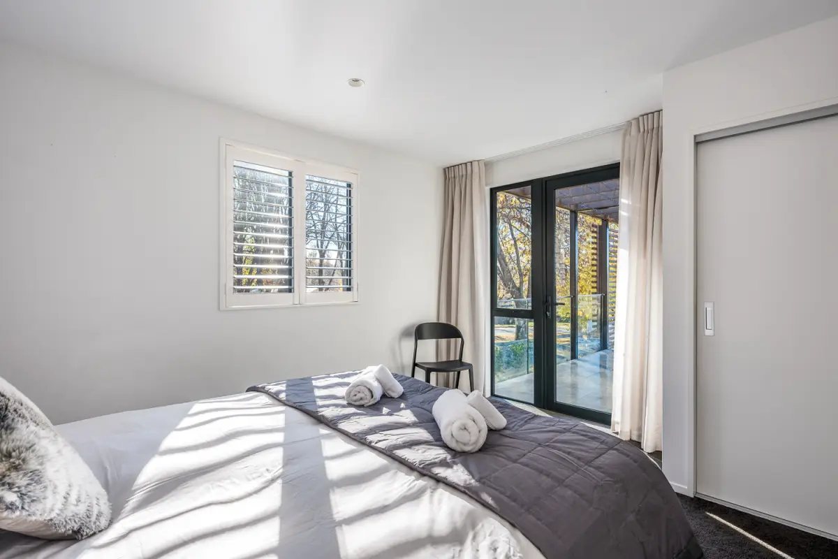 Master Bedroom with Access to Outdoor Area and Lake Views