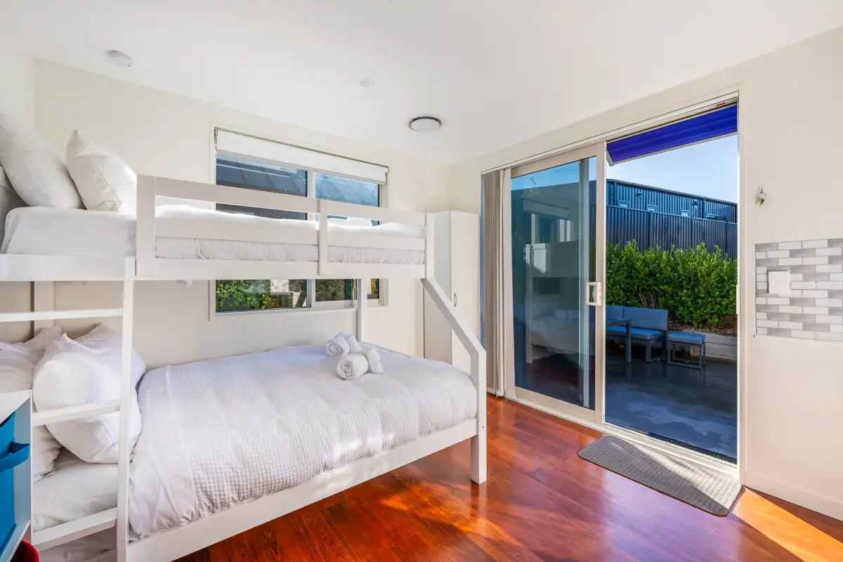 Bright Bunk Room with Access to Outside