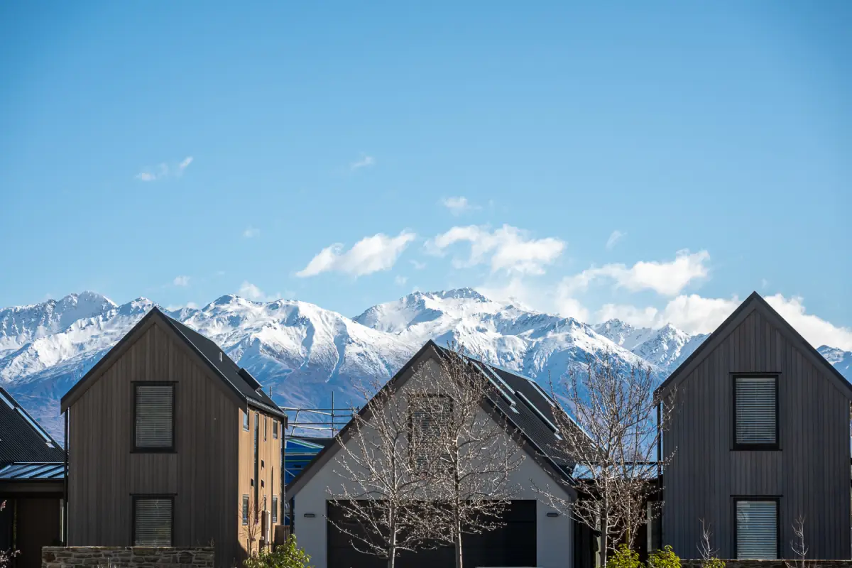 Snowy Peaks Beyond the Homes 