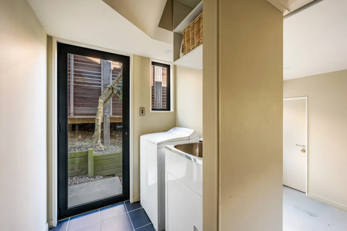 Laundry with Washing Machine. Dryer is located in the garage